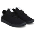 Black sneakers with white accents on a white background