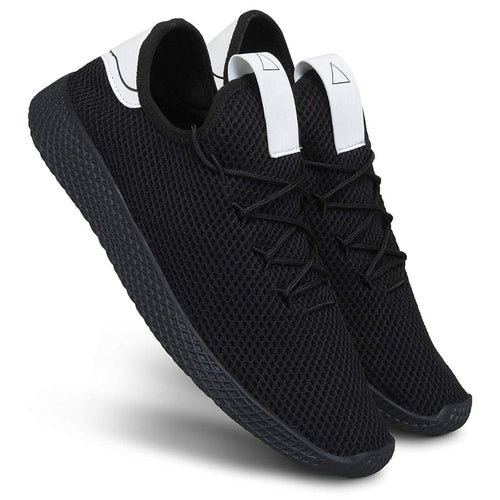 Black sneakers with white accents on a white background