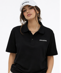 Person wearing a black polo shirt with 'SWAGSENS' logo and a white cap on a white background