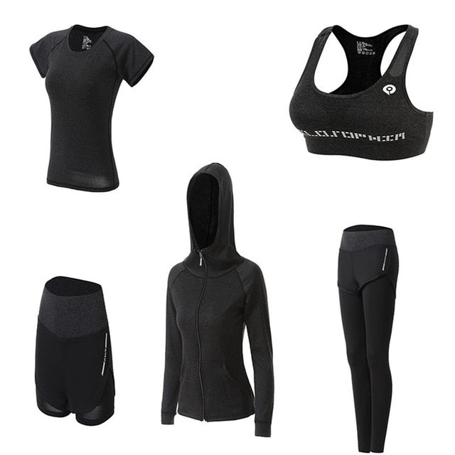 Set of black athletic wear including a t-shirt, sports bra, hoodie, shorts, and leggings on a white background.