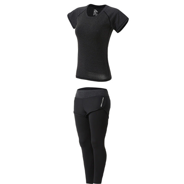 Black athletic outfit with short-sleeve top and leggings on a white background