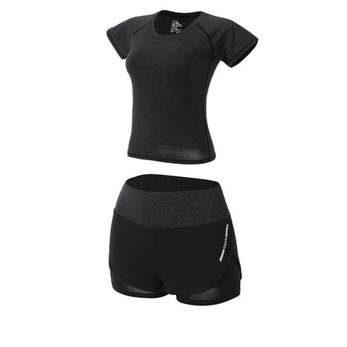 Black athletic shirt and shorts set on a white background